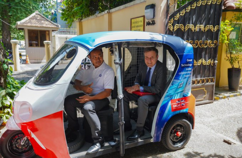 Greg in electric TukTuk in Cambodia