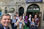 Greg Hands with Conservative supporters outside Parsons Green Tube Station.