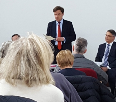 Greg Hands MP addressing his open meeting against Heathrow expansion in Fulham Library, with speakers from Heathrow Airport and NATS.