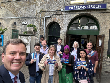 Greg Hands with Conservative supporters outside Parsons Green Tube Station.